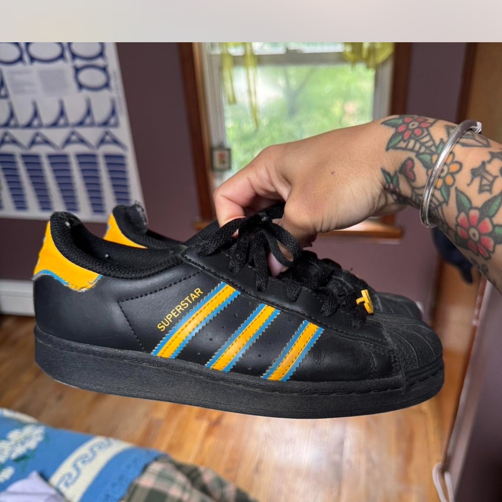 Adidas Black Sneakers with Yellow and Blue Accents